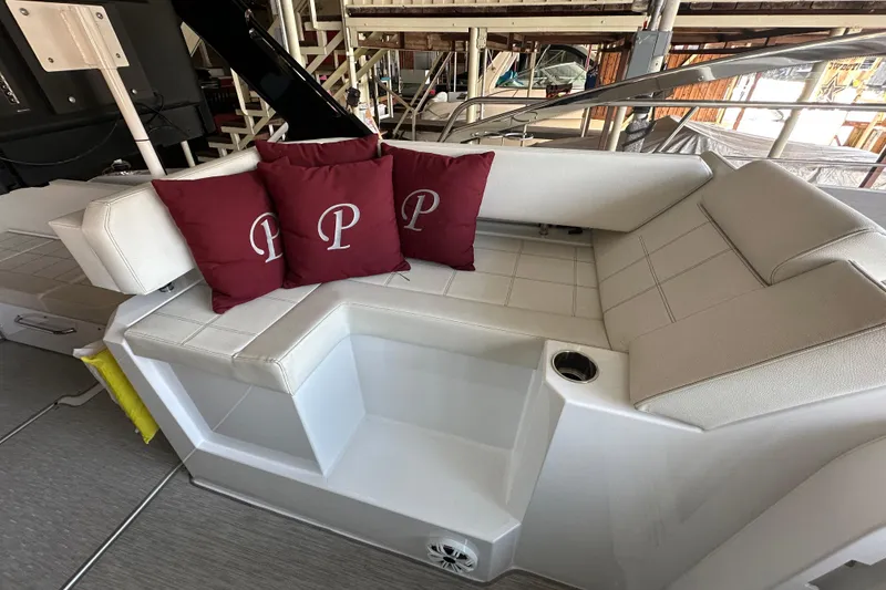 Slide: The Image of 2021 Cruisers Yachts 390 Express Coupe interior with white seating and red cushions. - 19