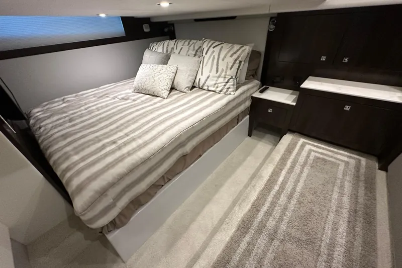 Slide: The Image of Luxurious bedroom interior of 2021 Cruisers Yachts 390 Express Coupe with modern decor. - 46