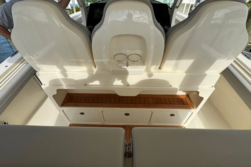 Slide: The Image of 2024 Scout 425 LXF boat interior with seating and storage compartments. - 23