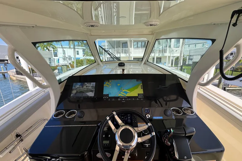 Slide: The Image of 2024 Scout 425 LXF boat cockpit with modern navigation system and steering wheel. - 27