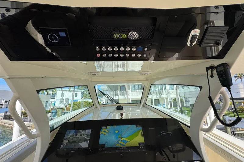 Slide: The Image of 2024 Scout 425 LXF boat cockpit with advanced navigation and control systems. - 28