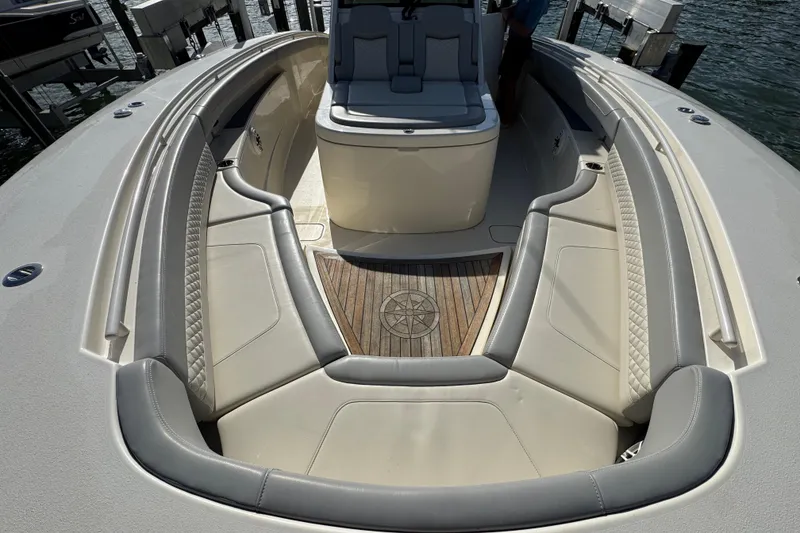 Slide: The Image of 2024 Scout 425 LXF boat interior with luxurious seating and wooden flooring. - 38