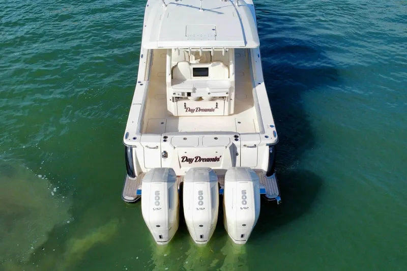 Slide: The Image of 2024 Scout 425 LXF boat with triple 500 V12 engines on water. - 4