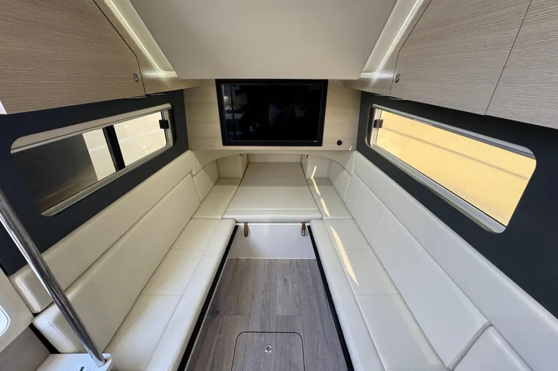Slide: The Image of Luxurious interior of 2024 Scout 425 LXF boat with modern seating and TV. - 41