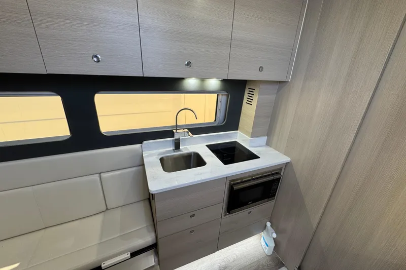 Slide: The Image of Modern kitchen interior of 2024 Scout 425 LXF with sleek cabinetry and appliances. - 43