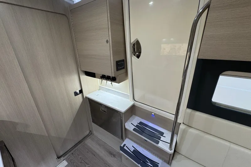 Slide: The Image of 2024 Scout 425 LXF interior with modern cabinetry and sleek design elements. - 45