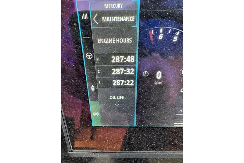 Slide: The Image of 2024 Scout 425 LXF engine hours display showing maintenance details. - 54