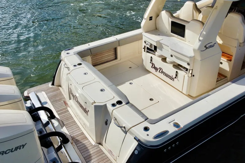 Slide: The Image of 2024 Scout 425 LXF boat with spacious deck and dual Mercury engines. - 9