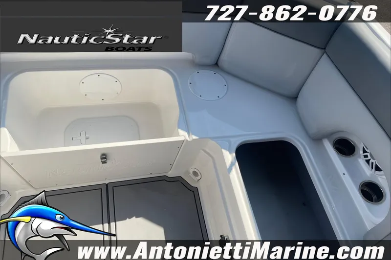Slide: The Image of 2023 NauticStar 243 DC boat interior with seating and storage compartments. - 12