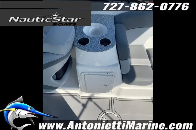 Slide: The Image of 2023 NauticStar 243 DC boat interior with seating and cup holders, Antonietti Marine branding. - 13