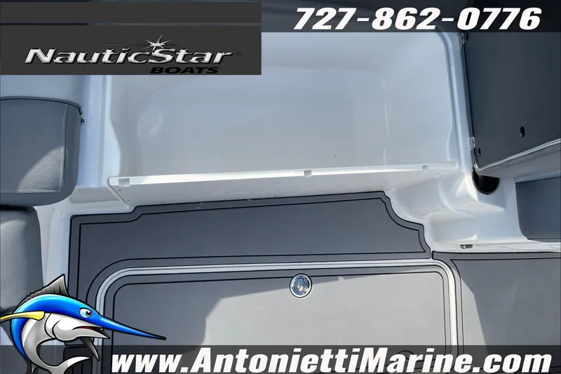 Slide: The Image of 2023 NauticStar 243 DC boat interior with seating and flooring details. - 17