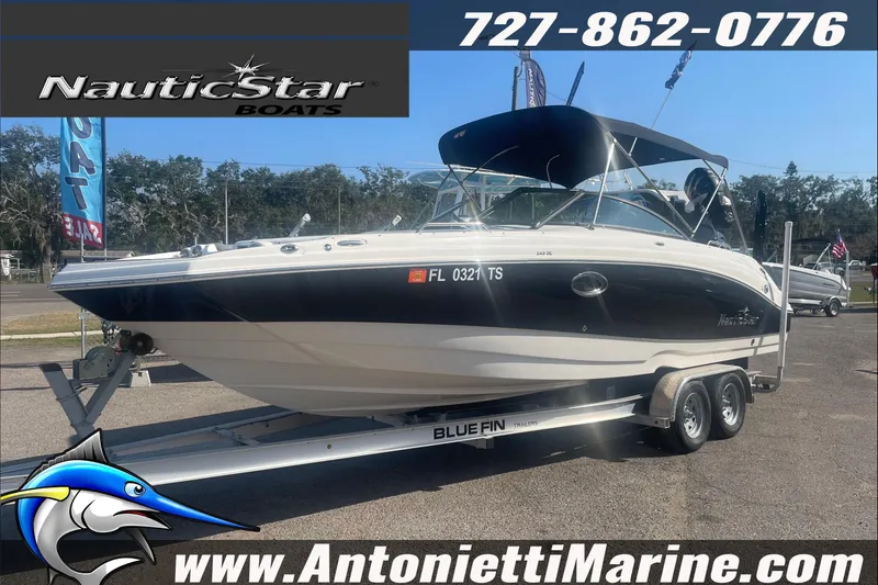 Slide: The Image of 2023 NauticStar 243 DC boat on trailer at Antonietti Marine dealership. - 2