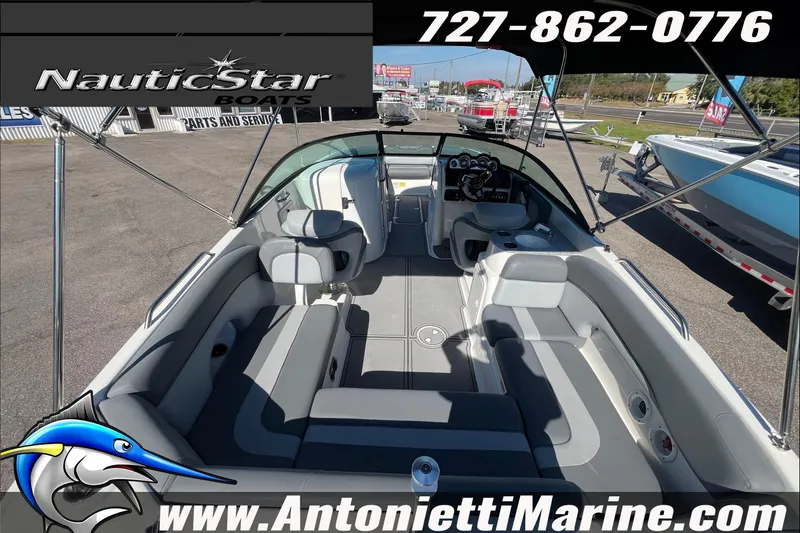 Slide: The Image of 2023 NauticStar 243 DC boat interior at Antonietti Marine dealership. - 3