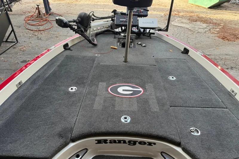 Slide: The Image of 2014 Ranger Z520 Comanche boat deck with fishing equipment and logo. - 10