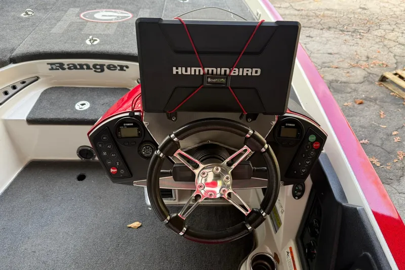 Slide: The Image of 2014 Ranger Z520 Comanche boat dashboard with Humminbird electronics and Yamaha controls. - 15