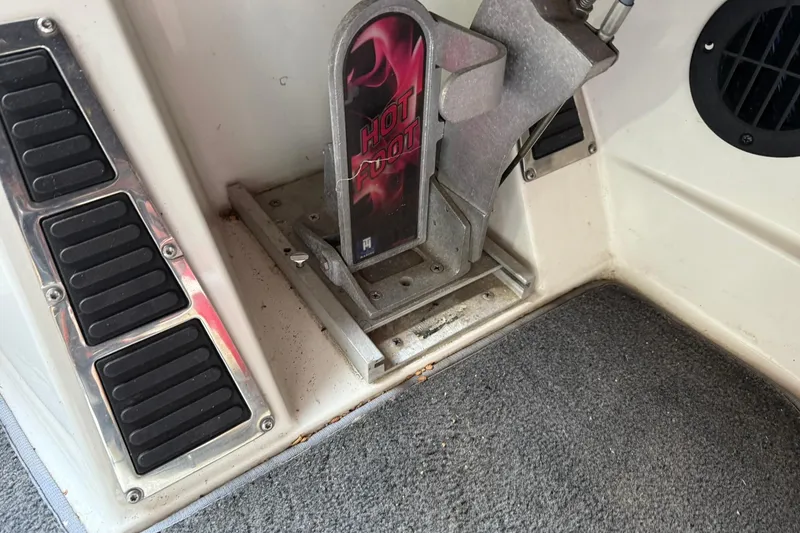 Slide: The Image of 2014 Ranger Z520 Comanche boat foot pedal with "Hot Foot" branding, carpeted floor. - 18