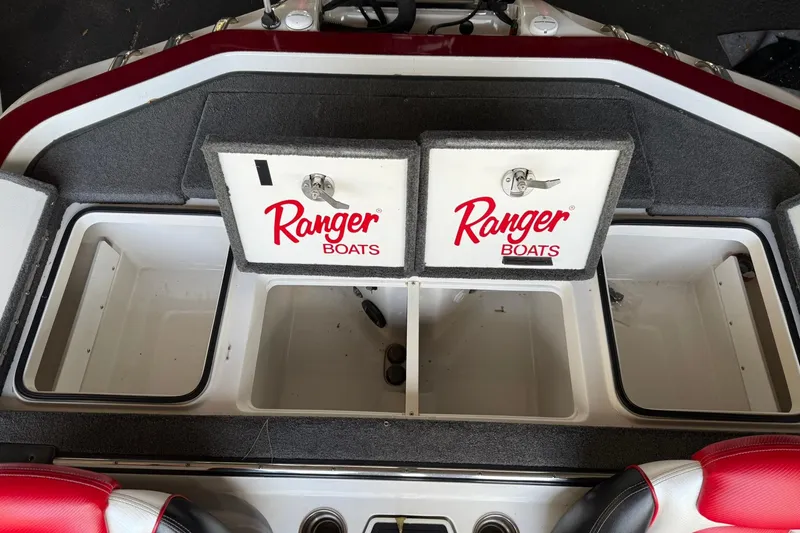 Slide: The Image of 2014 Ranger Z520 Comanche boat storage compartments with Ranger Boats branding. - 9
