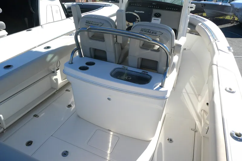 Slide: The Image of 2017 Boston Whaler 250 Outrage boat interior with seating and control panel. - 3