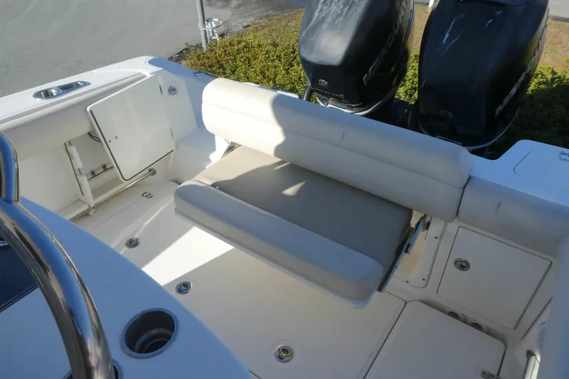 Slide: The Image of 2017 Boston Whaler 250 Outrage boat interior with seating and dual outboard engines. - 5