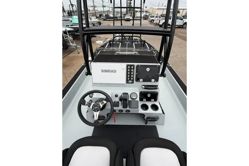 Slide: The Image of 2026 Mamba 24 Cat Elite boat deck with sleek black and white design. - 10