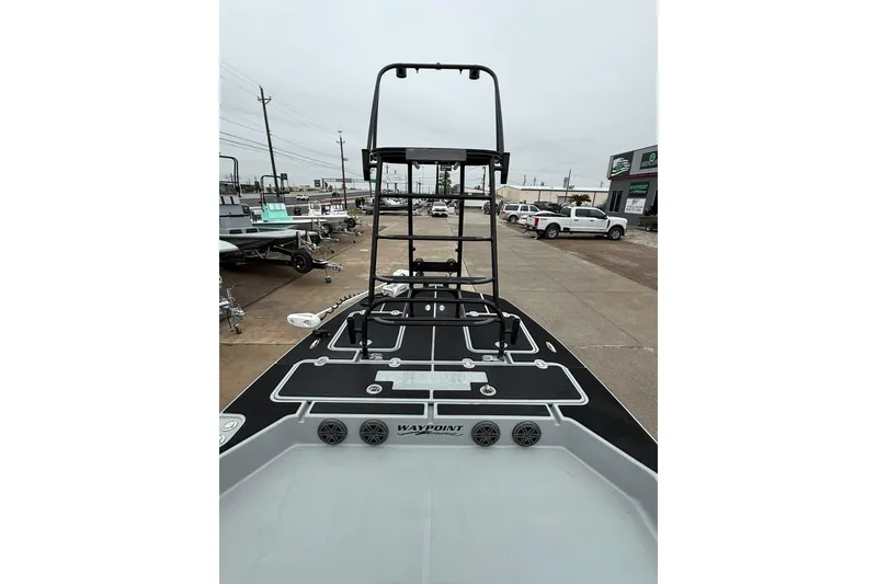 Slide: The Image of 2026 Mamba 24 Cat Elite boat deck with seating and sleek design. - 14