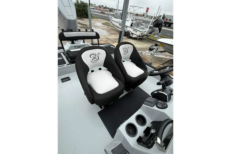 Slide: The Image of Open storage compartment in 2026 Mamba 24 Cat Elite boat, showcasing interior design. - 16