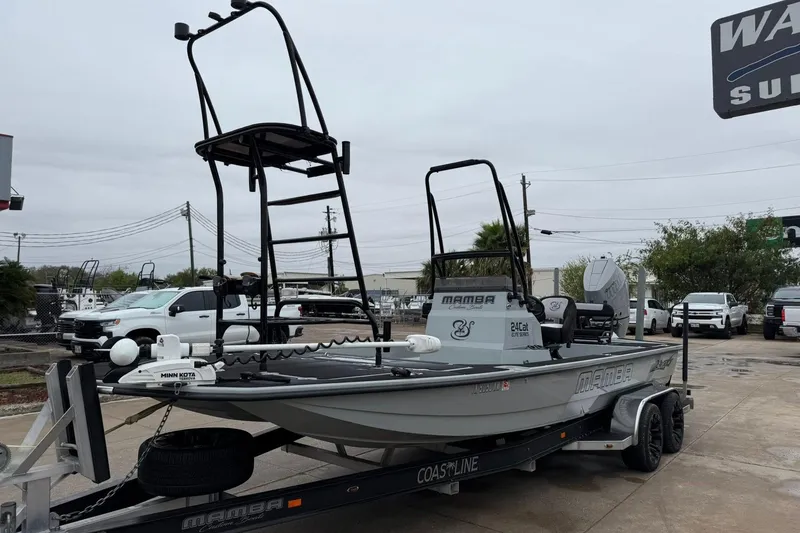 Slide: The Image of 2026 Mamba 24 Cat Elite boat on trailer at dealership. - 27