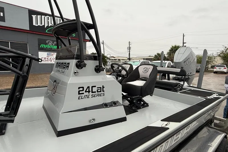 Slide: The Image of 2026 Mamba 24 Cat Elite boat, sleek design, modern features, and custom graphics. - 3
