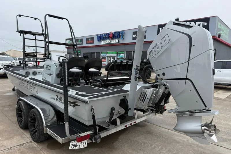 Slide: The Image of 2026 Mamba 24 Cat Elite boat interior with speakers and sleek design. - 6