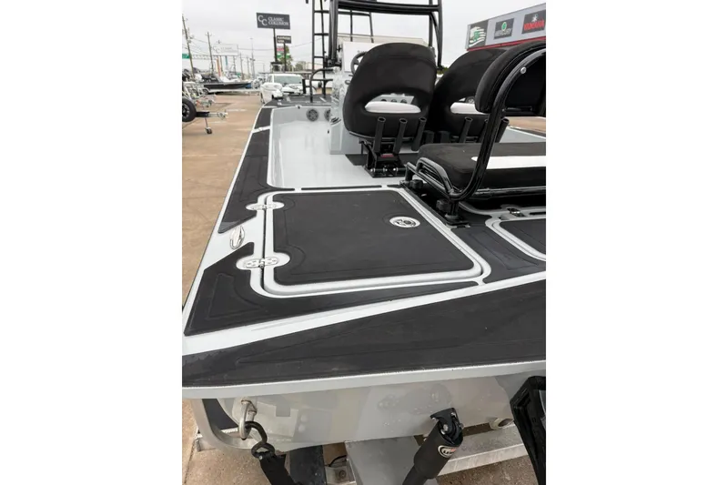 Slide: The Image of 2026 Mamba 24 Cat Elite boat dashboard with Simrad electronics and steering wheel. - 7