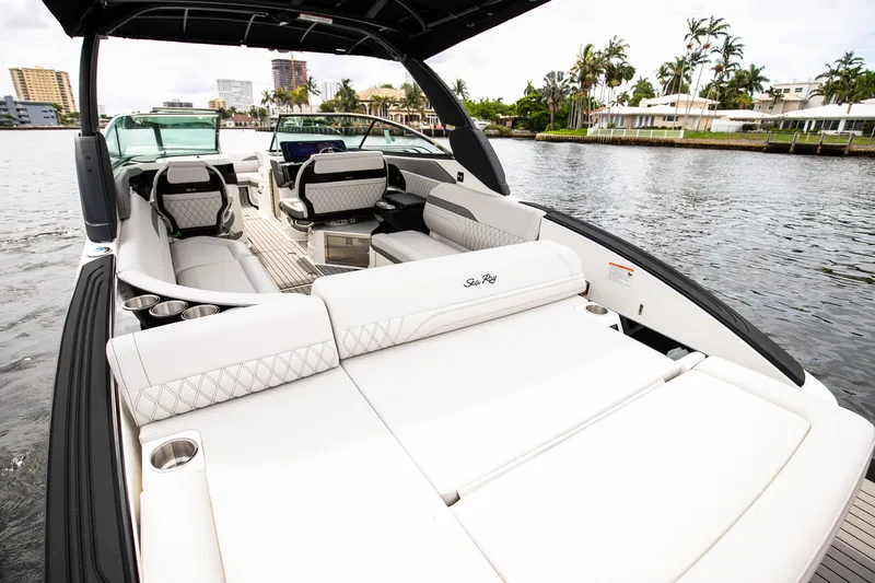 Slide: The Image of Luxurious Sea Ray SLX 280 Outboard boat on calm water. - 16