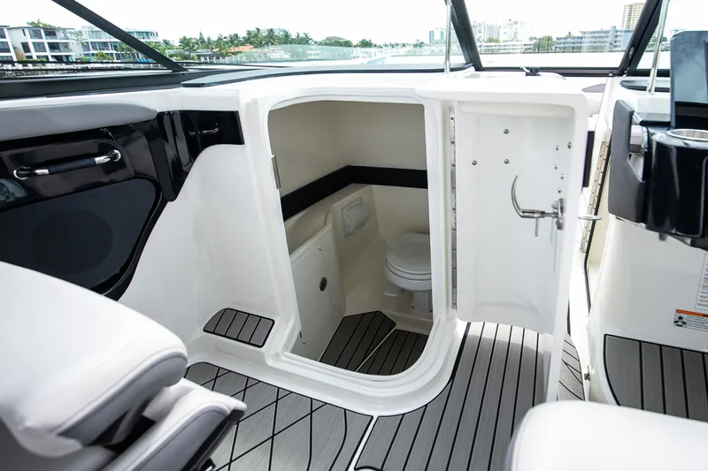 Slide: The Image of Interior of 2026 Sea Ray SLX 280 Outboard featuring a toilet. - 44