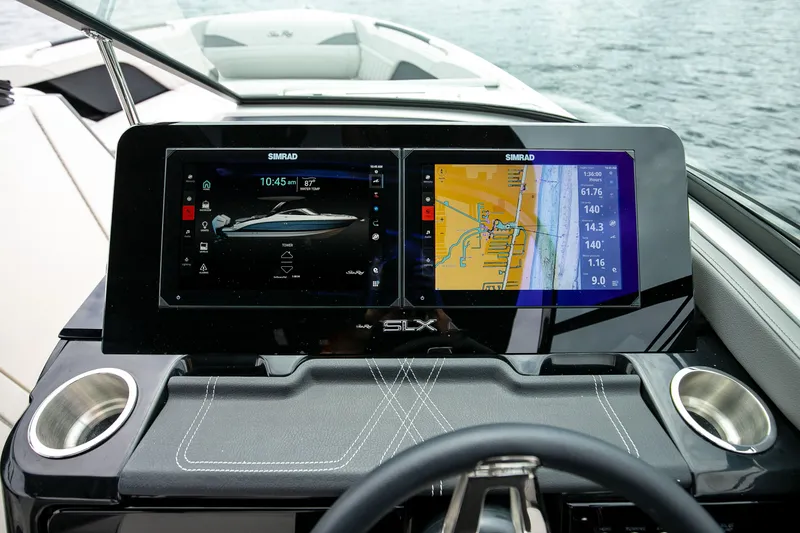 Slide: The Image of Sea Ray SLX 280 Outboard 2026 with Simrad displays on water. - 52