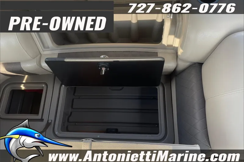 Slide: The Image of Pre-owned 2024 Sun Tracker SportFish 22 DLX boat interior storage compartment. - 12