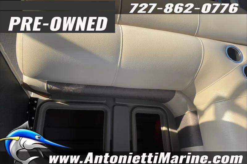Slide: The Image of Pre-owned 2024 Sun Tracker SportFish 22 DLX boat interior with beige seating. - 13