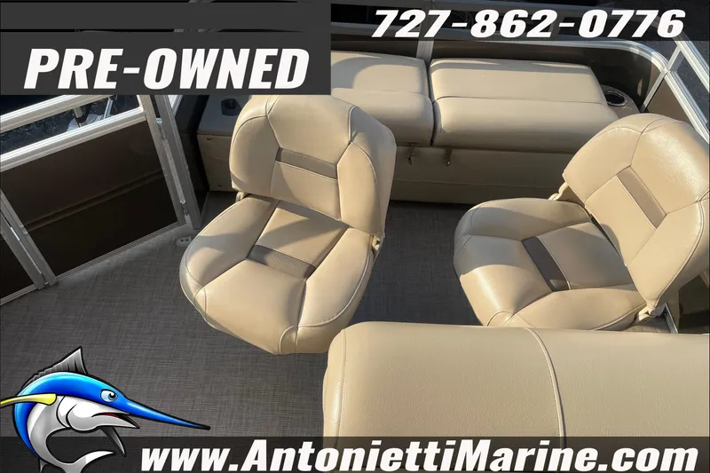 Slide: The Image of Pre-owned 2024 Sun Tracker SportFish 22 DLX boat interior with beige seating. - 14