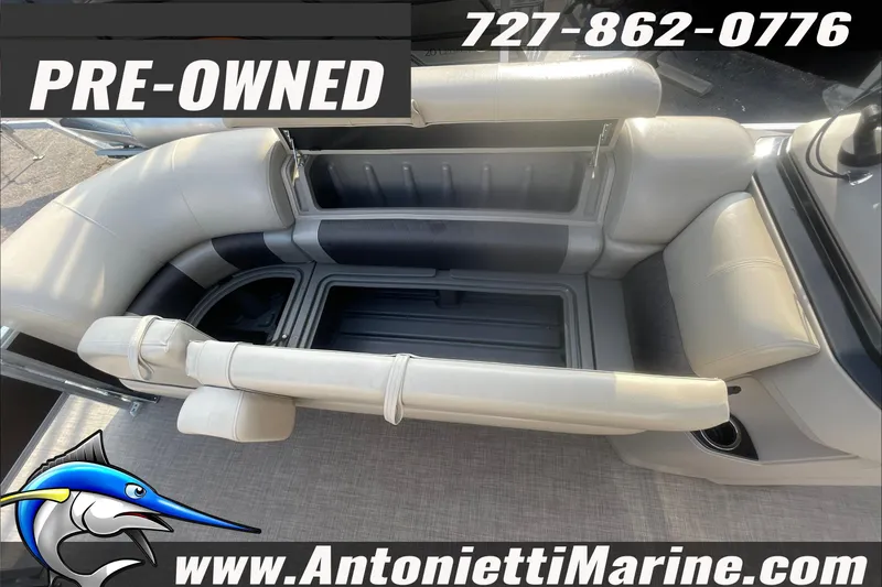 Slide: The Image of Pre-owned 2024 Sun Tracker SportFish 22 DLX boat interior with seating and storage. - 9