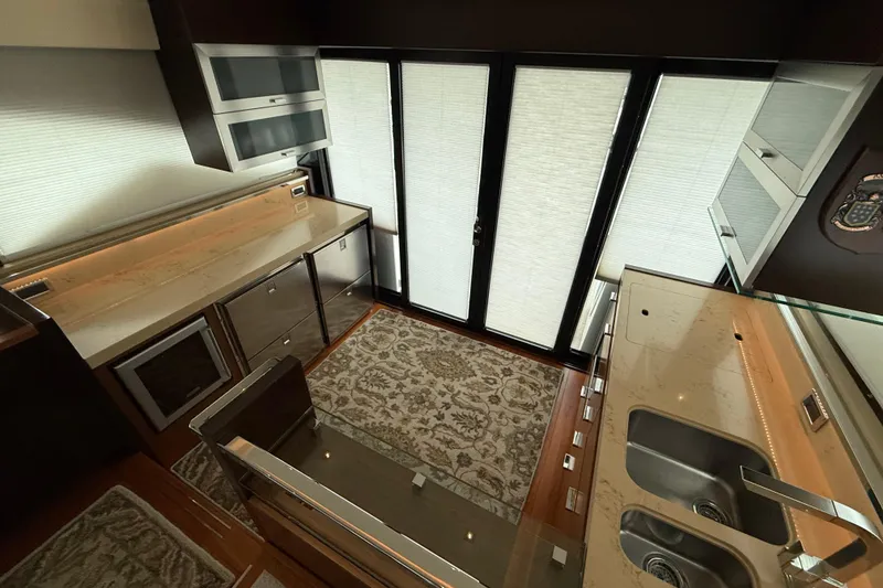 Slide: The Image of Luxurious kitchen interior of 2016 Tiara Yachts 50 Coupe with modern appliances and elegant design. - 10