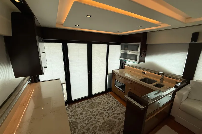 Slide: The Image of Luxurious interior of 2016 Tiara Yachts 50 Coupe with modern kitchen and elegant lighting. - 11