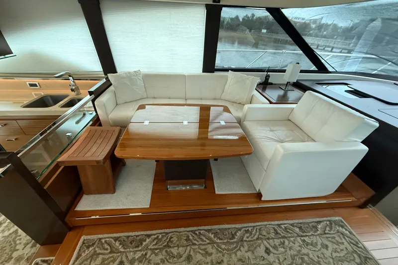 Slide: The Image of Luxurious interior of 2016 Tiara Yachts 50 Coupe with elegant seating and wooden table. - 21