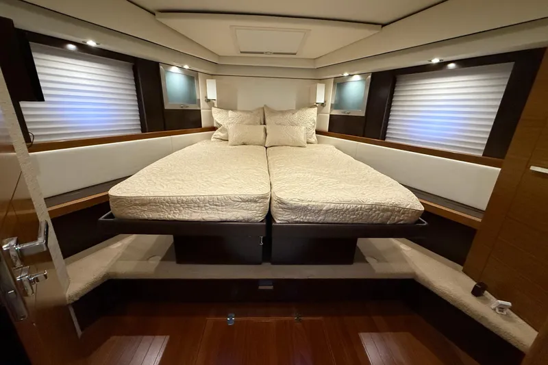 Slide: The Image of Luxurious bedroom interior of 2016 Tiara Yachts 50 Coupe with elegant bedding and ambient lighting. - 33