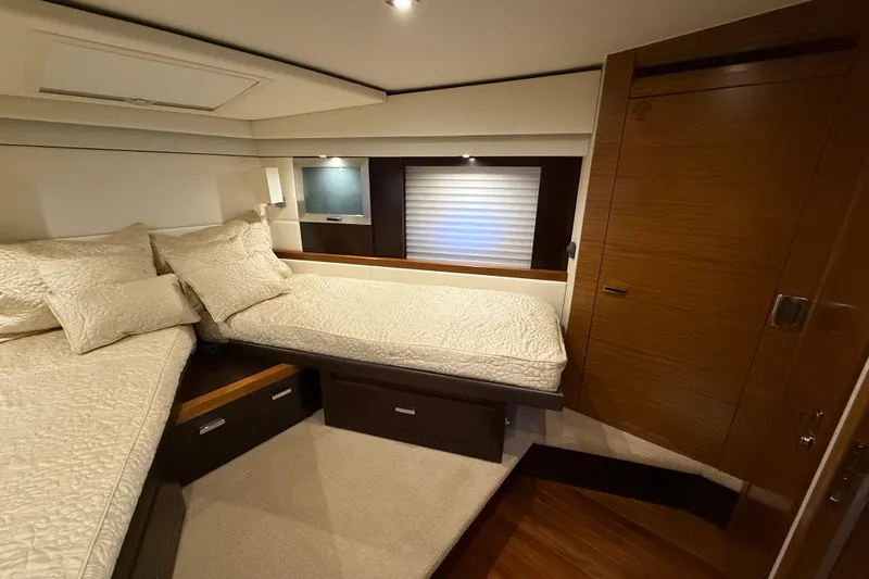 Slide: The Image of Luxurious bedroom interior of 2016 Tiara Yachts 50 Coupe with elegant bedding and wood finishes. - 35