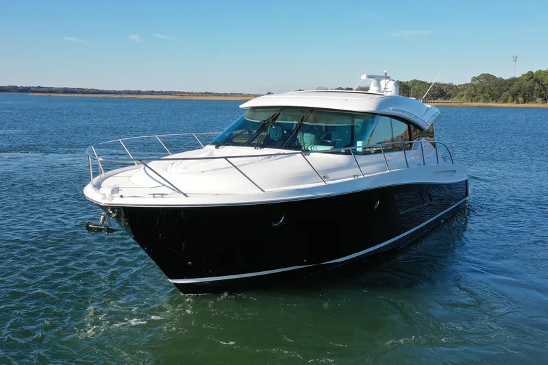 Slide: The Image of 2016 Tiara Yachts 50 Coupe cruising on open water. - 4