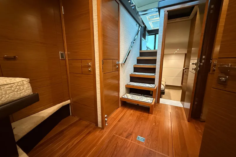 Slide: The Image of Luxurious interior of 2016 Tiara Yachts 50 Coupe with wooden flooring and elegant staircase. - 42
