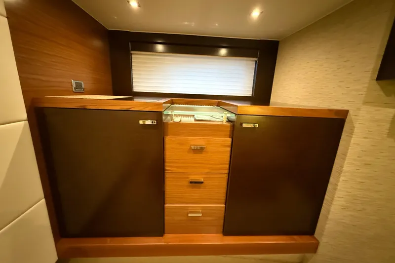 Slide: The Image of 2016 Tiara Yachts 50 Coupe interior with wooden cabinetry and modern design. - 48