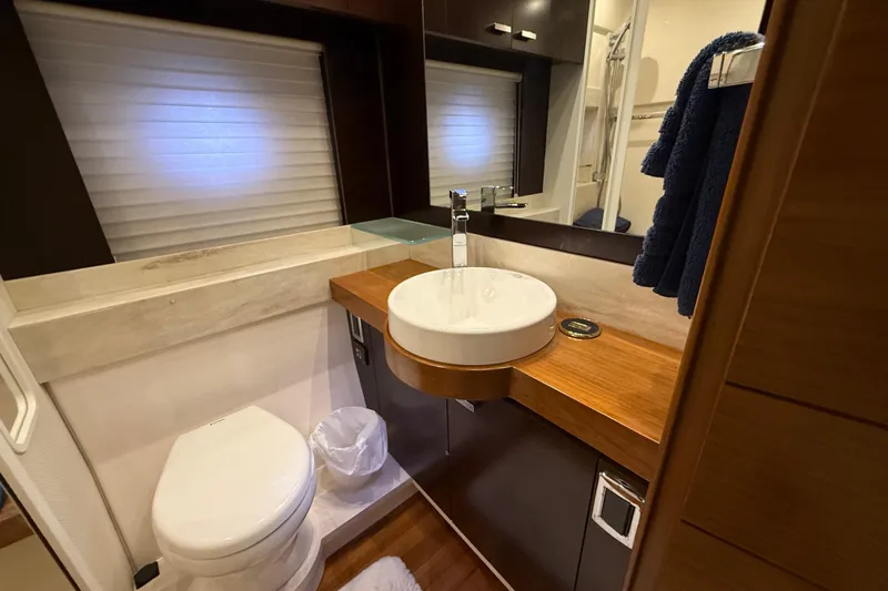 Slide: The Image of Luxurious bathroom in 2016 Tiara Yachts 50 Coupe with modern fixtures and elegant design. - 50