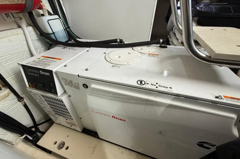 Slide: The Image of Cummins Onan generator in 2016 Tiara Yachts 50 Coupe engine room. - 60