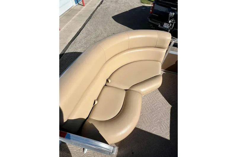 Slide: The Image of 2013 South Bay 417 CR boat interior with beige seating and speaker. - 10