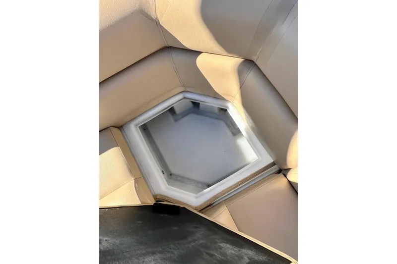 Slide: The Image of Open storage compartment in 2013 South Bay 417 CR boat seat. - 26