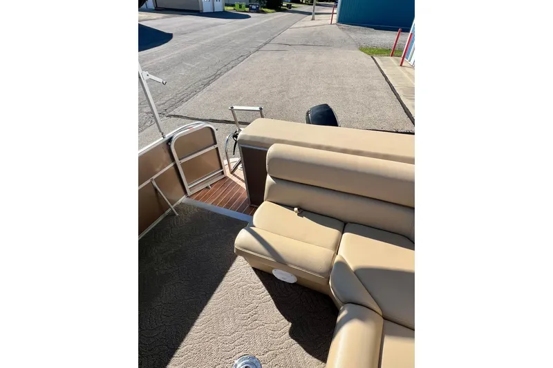 Slide: The Image of 2013 South Bay 417 CR boat interior with beige seating and steering wheel. - 28